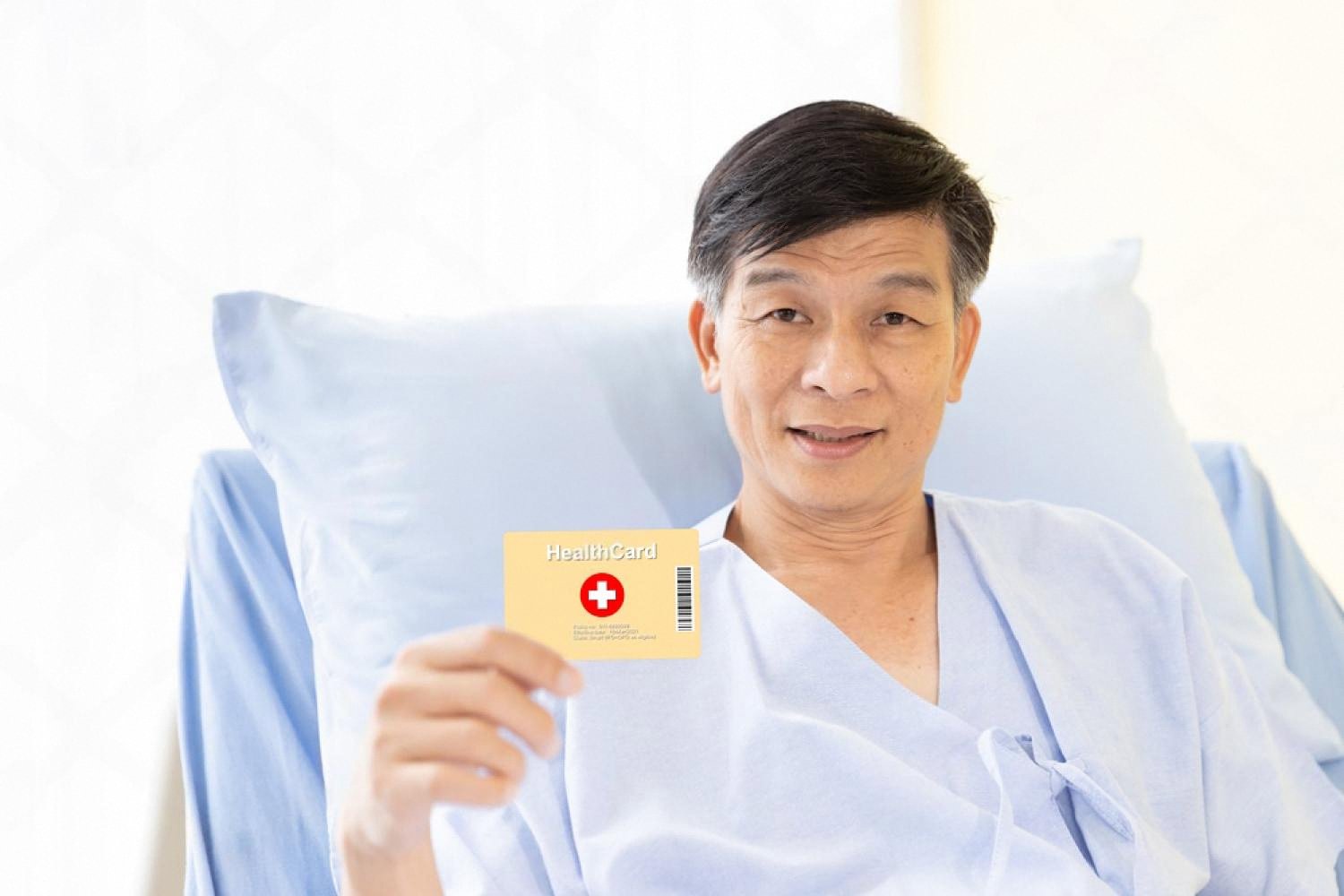 Patient in a UAE hospital holding a health insurance card, representing medical factors in life cover pricing