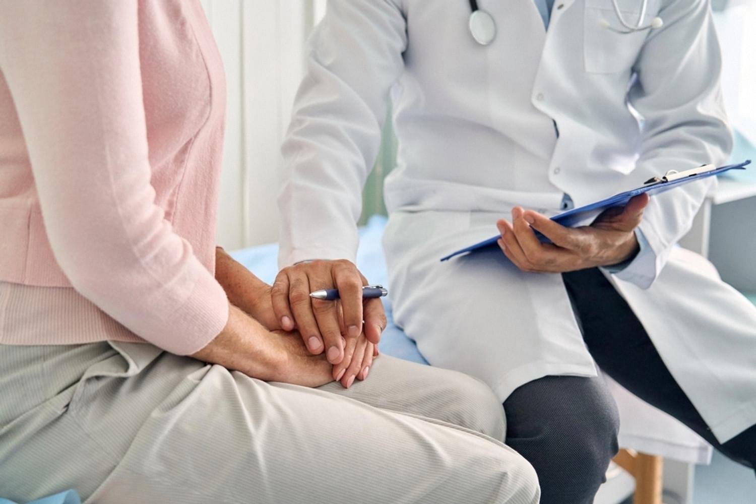 Doctor consulting a patient during medical underwriting for a UAE life insurance application